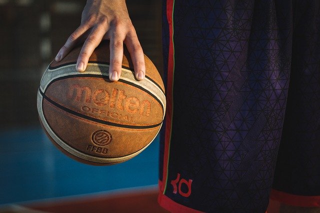 Mysetery NBA star holding basketball